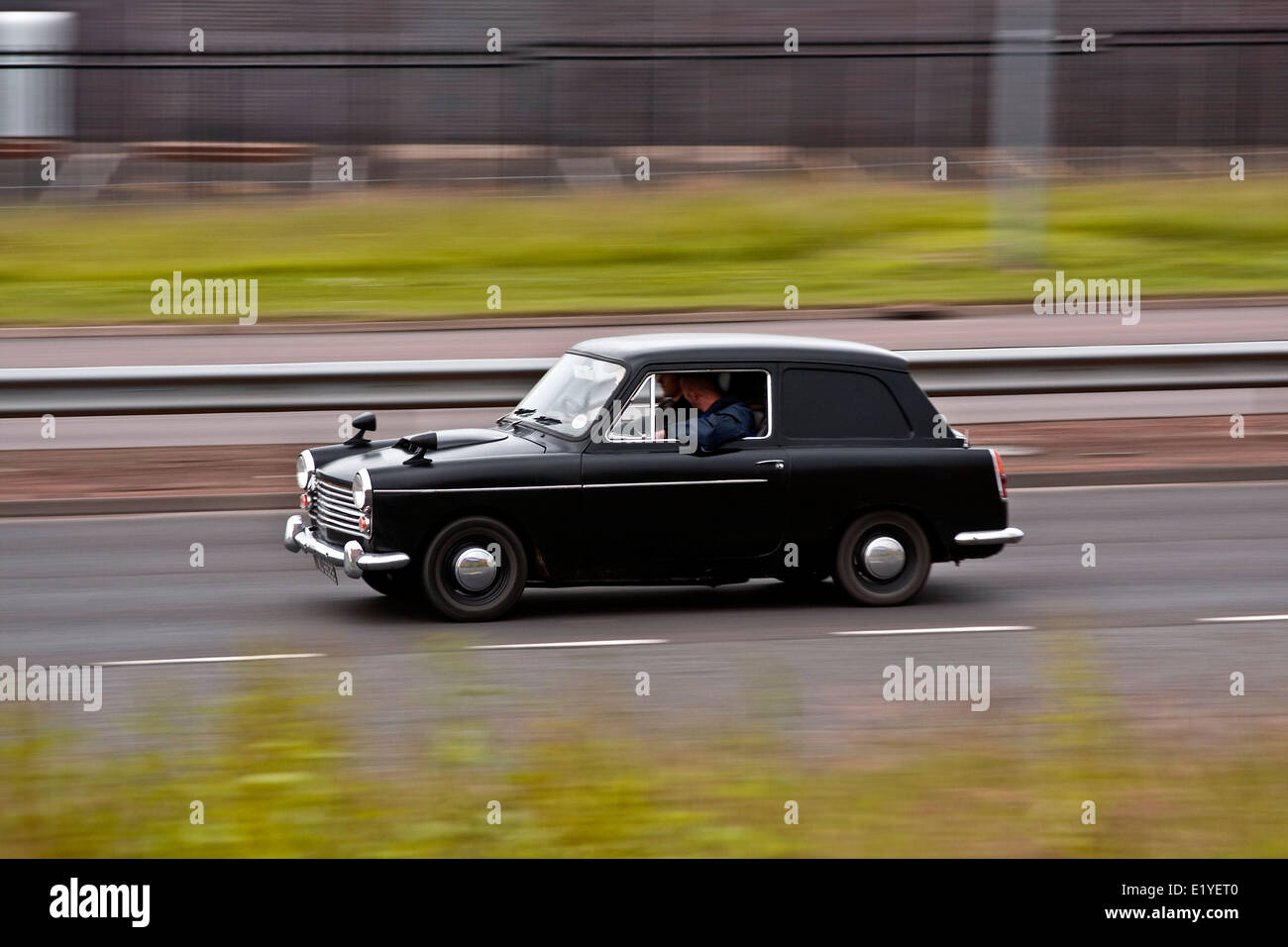 A black coloured 1970`s Austin Morris 1100 travelling along the Kingsway West Dual Carriageway in Dundee, UK Stock Photo